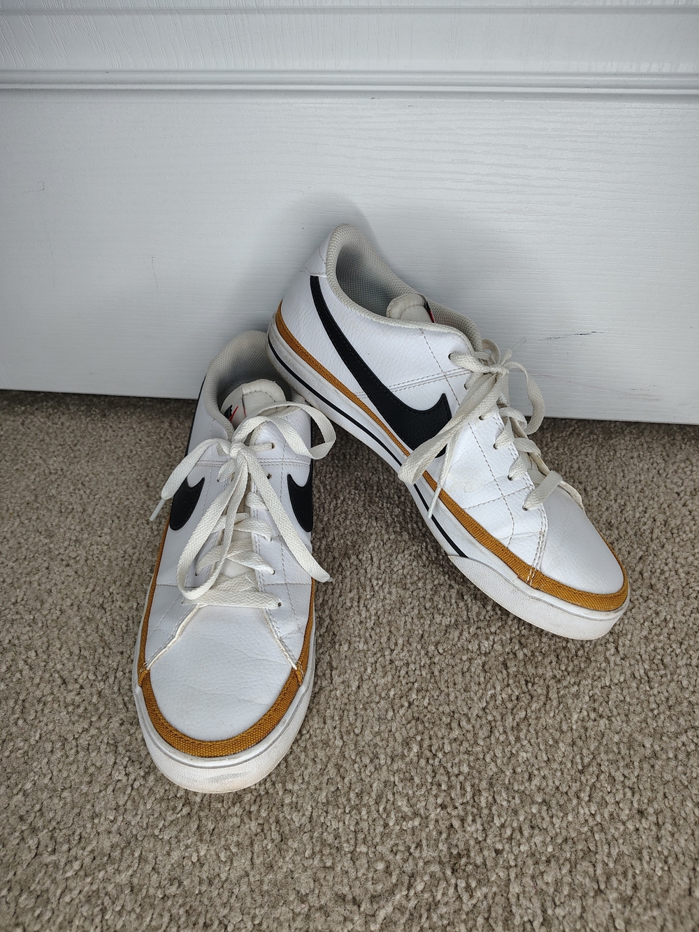 Nike Men’s White & Black Low-Top Sneakers with Gold Accent